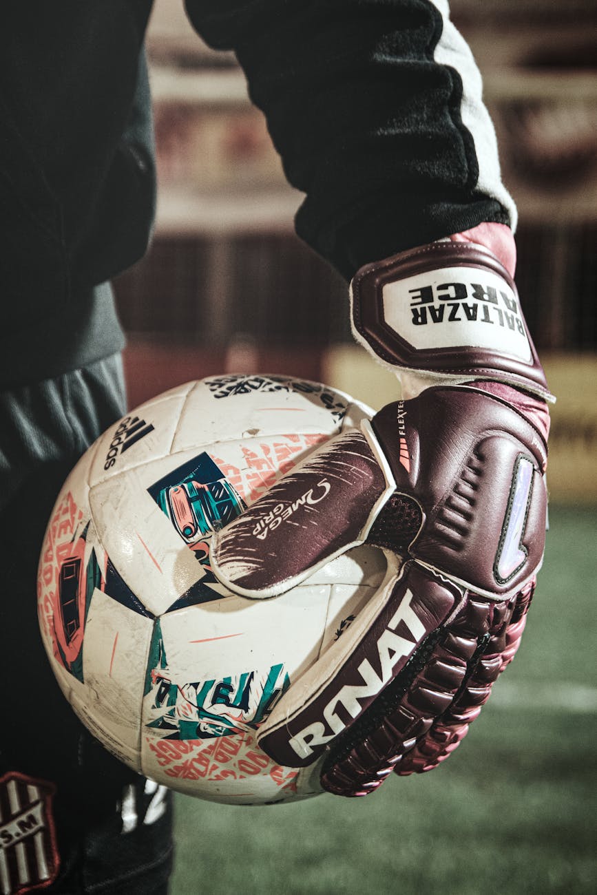 a player holding a soccer ball