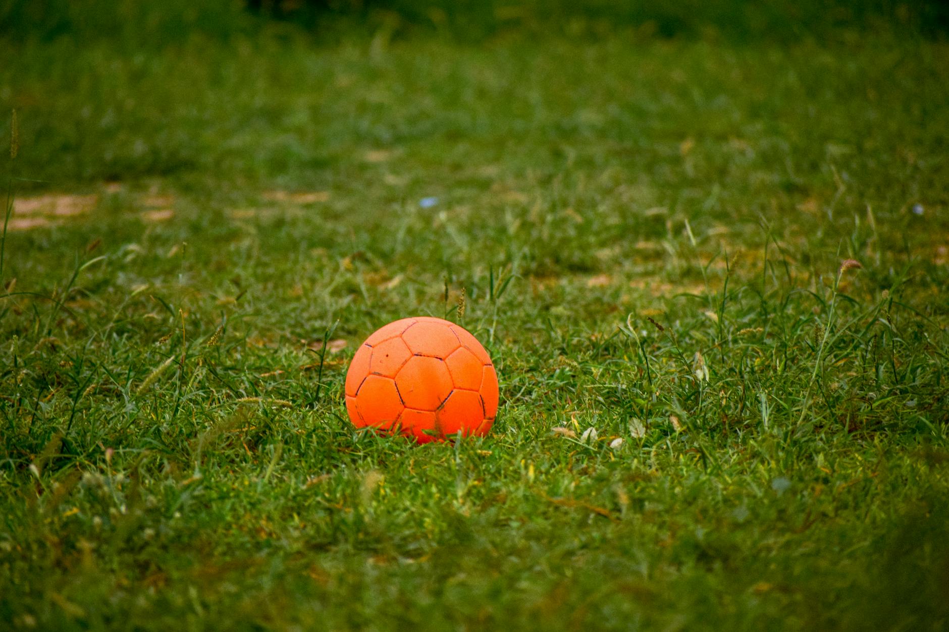 tilt shift lens photography of orange ball